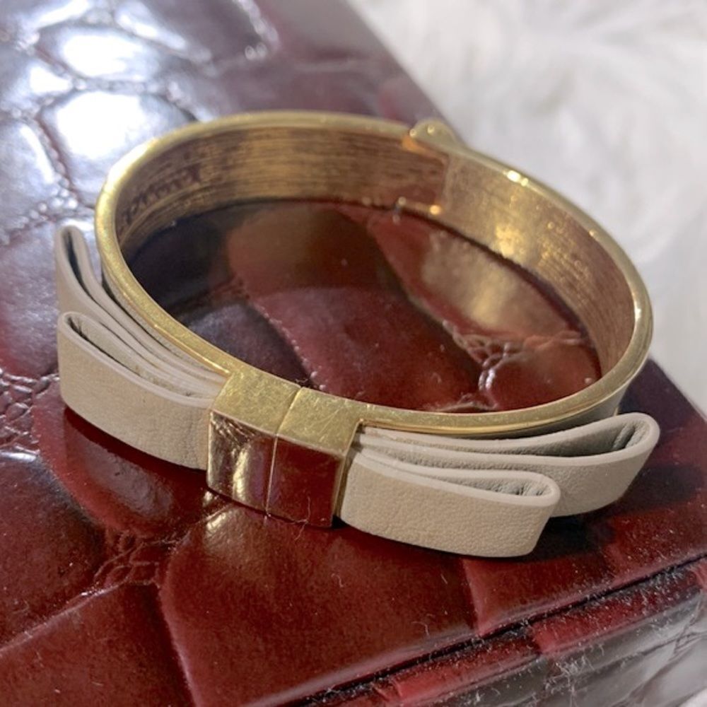 VINCE Camuto goldtone bangle bracelet with leather detai magnetic closure